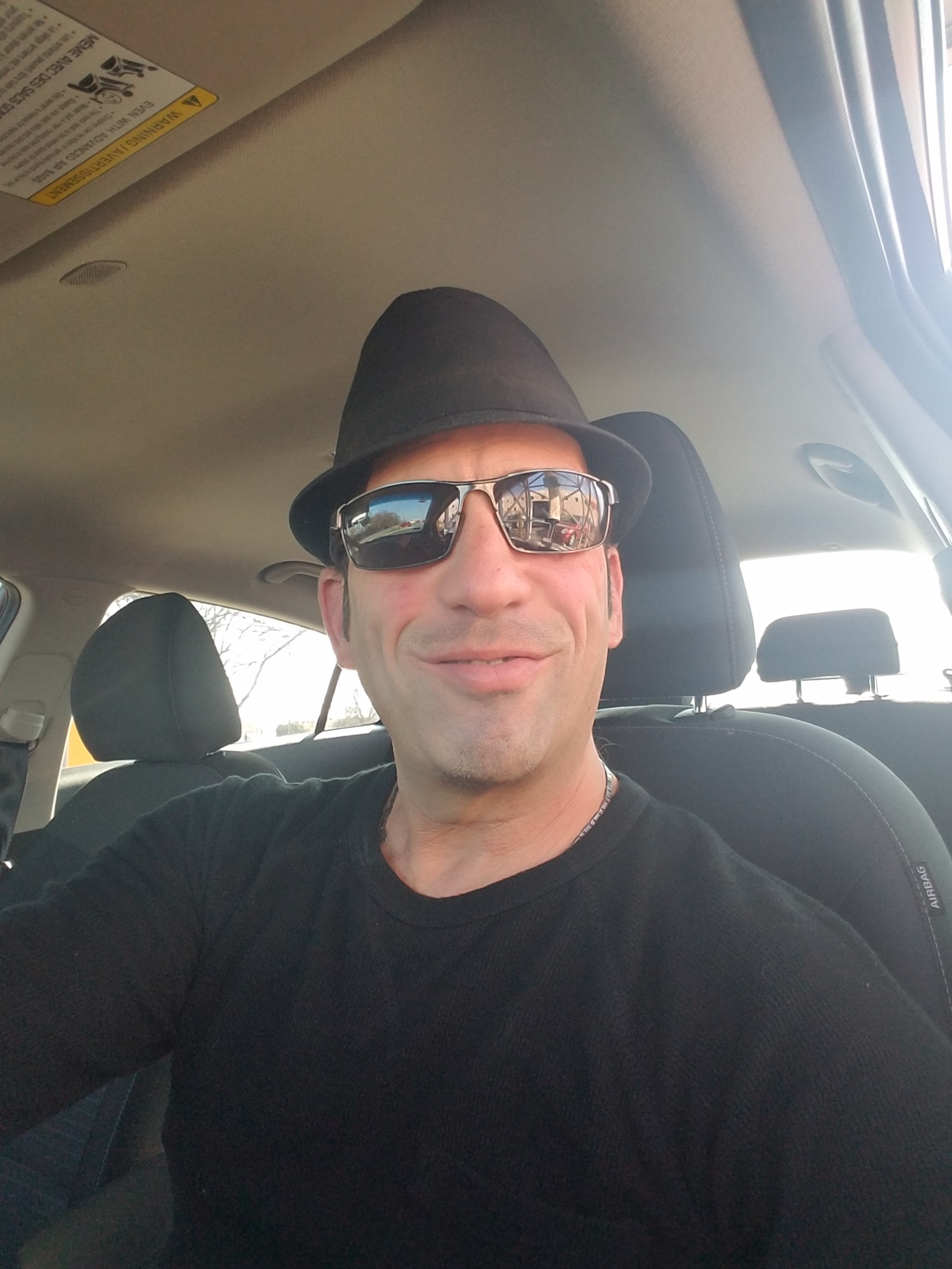 Christian — black hat and sunglasses
